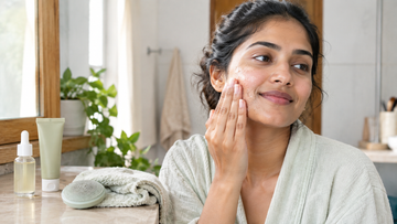 Woman exfoliating her face